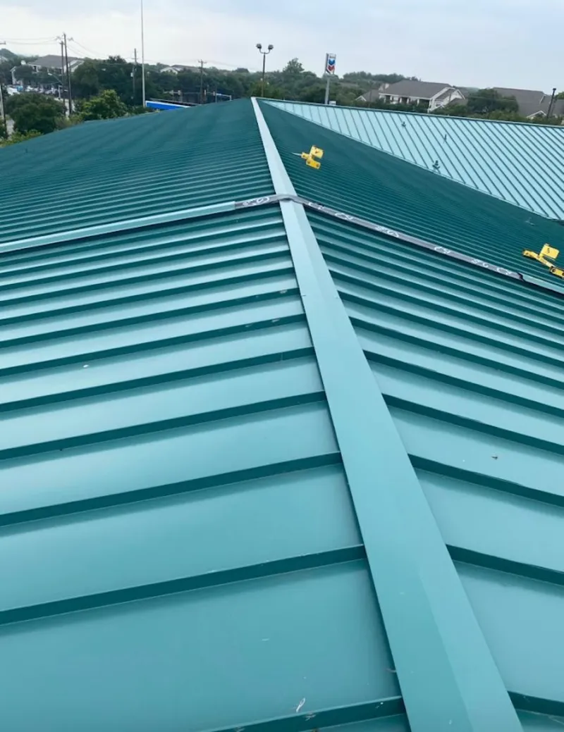 Green commercial metal roof ridge and valley for Metal Roof Repair in Livingston